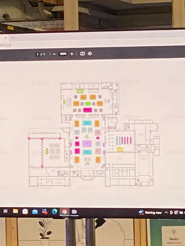 Behind the scenes at SaaStock Europe 2022 — laptop screen showing the SaaStock Dublin 2022 floor plan PDF being previewed by the production team before going to print on the on-site map standee