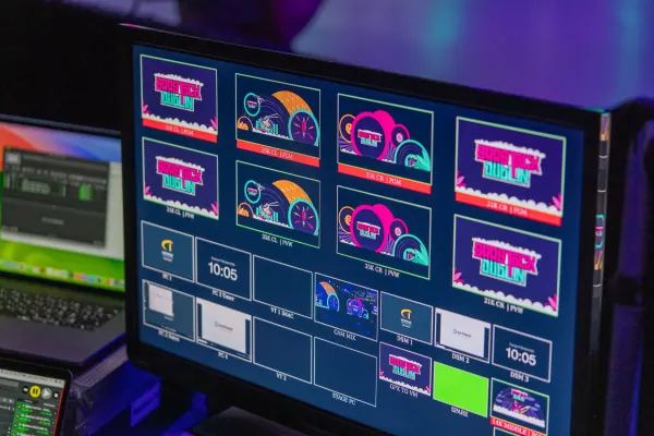 Behind the scenes at SaaStock Europe 2023 — production control-room cue monitor showing the SaaStock Dublin Mainstage screen grid with talk slots, stage logos and a 10:05 cue time