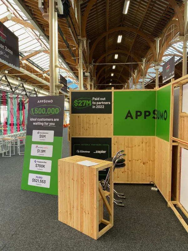 Before doors at SaaStock Europe 2023 — AppSumo sponsor booth advertising $27M paid out to partners in 2022 and 1.5 million potential customers, Dublin