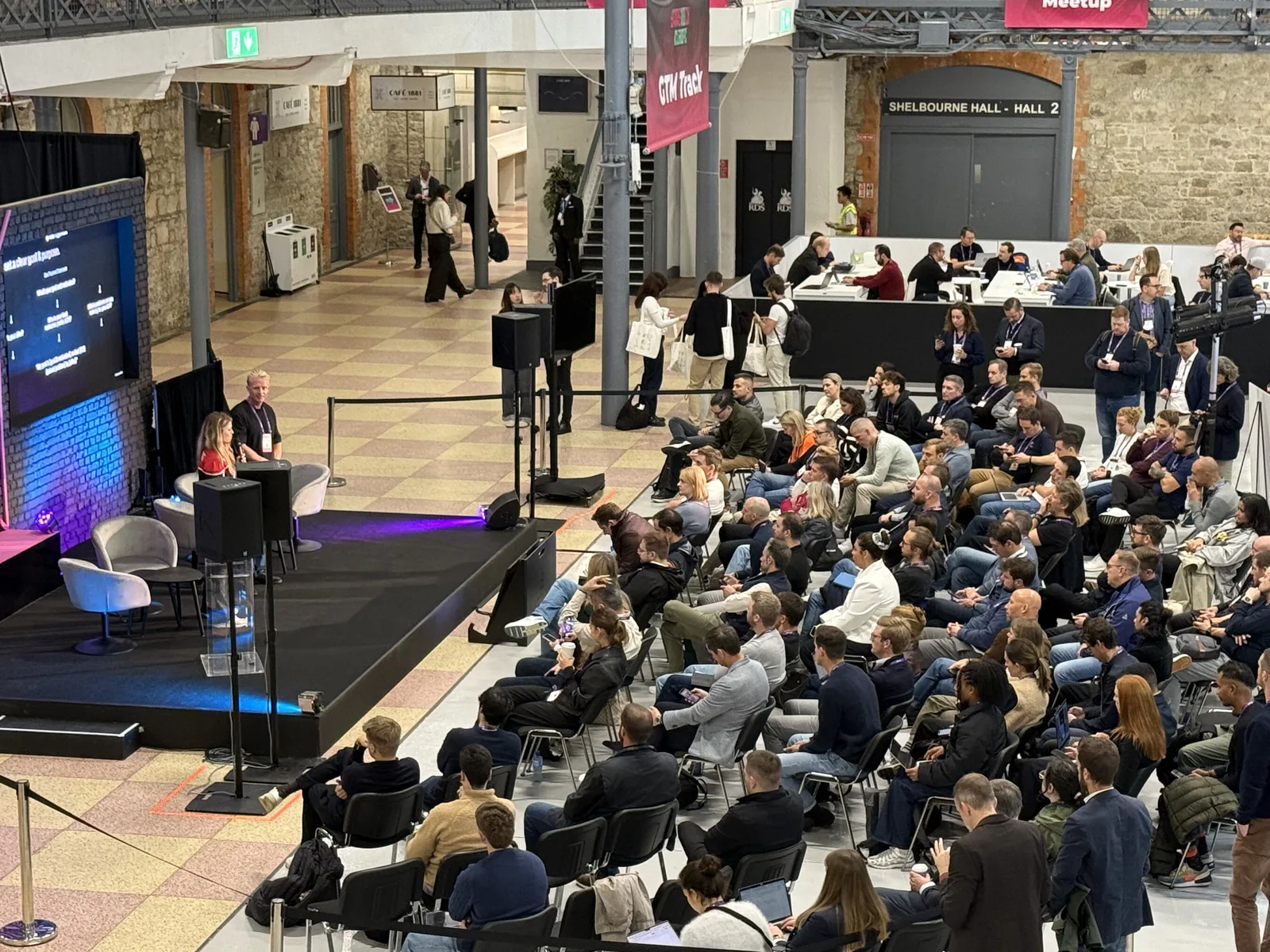 GTM Track stage at SaaStock Europe 2025 — operators on stage in front of a seated audience of B2B SaaS founders at the RDS, Dublin