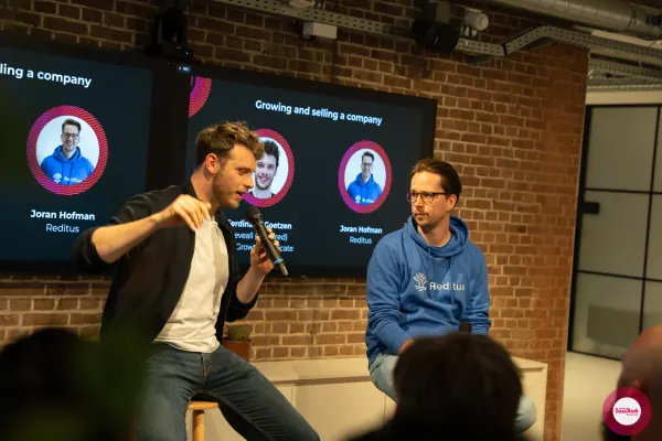 Ferdinand Goetzen presenting his 'Growing and selling a company' slide at SaaStock Local Amsterdam Q2 2024