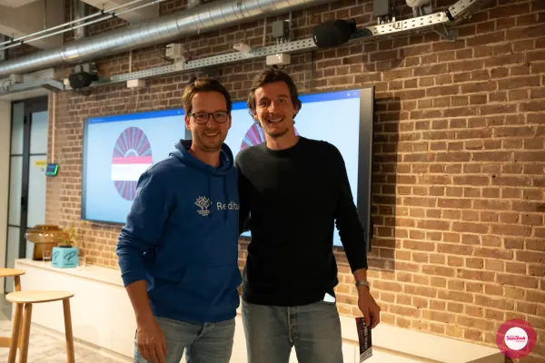 Live at SaaStock Local Amsterdam Q2 2024 — alternate framing of Joran Hofman and the prize-wheel winner in front of the SaaStock Dublin prize wheel screens